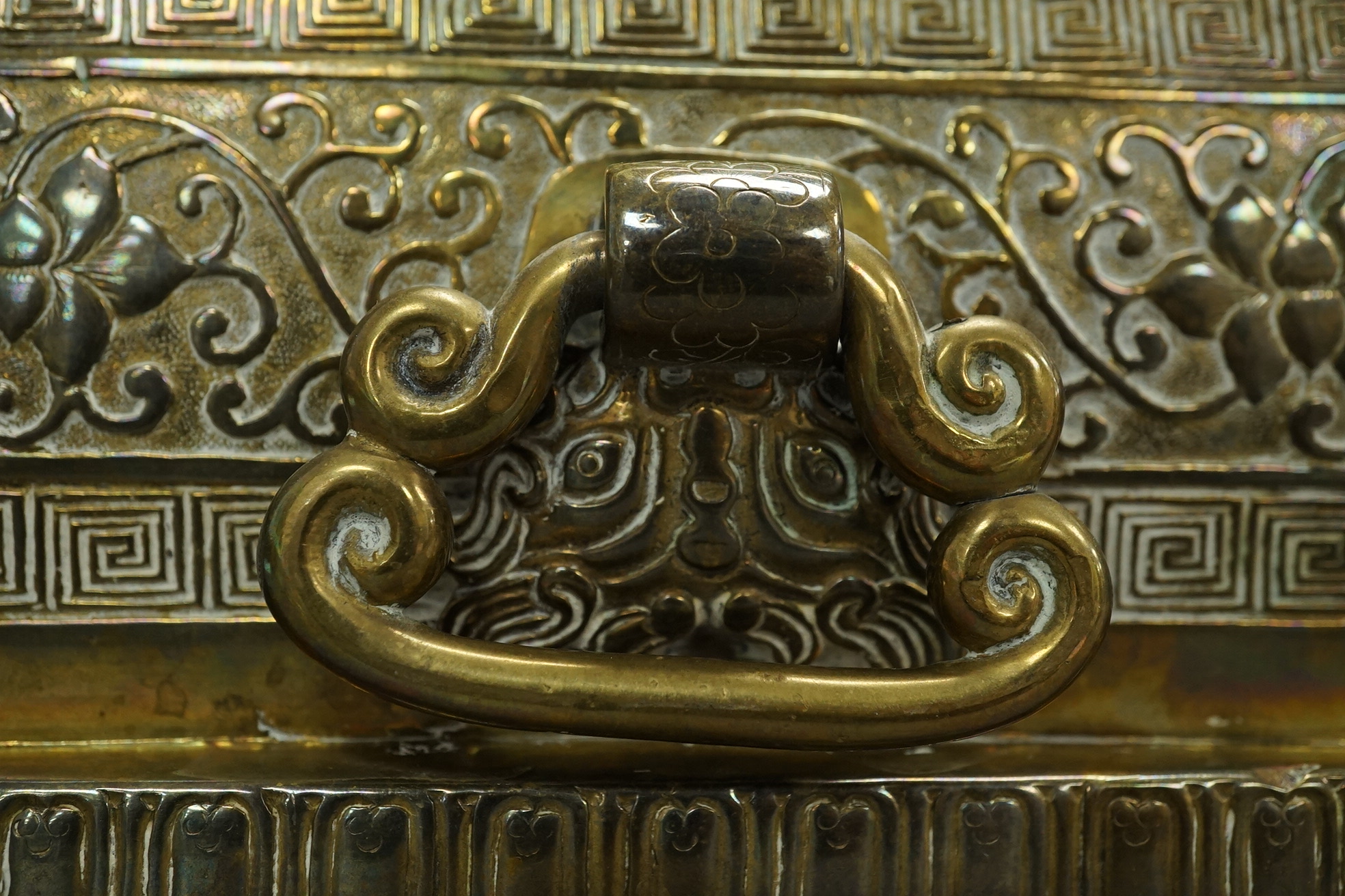 A large Chinese bronze rectangular censer and cover, Xuande seal mark, and a ‘plum blossom and chilong’ bronze censer, both 19th century